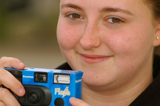 Student holding camera