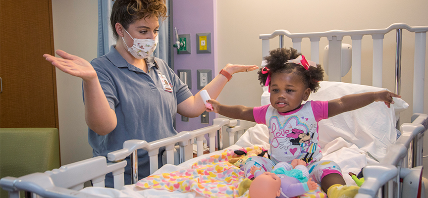 Child Life specialist with Le Bonheur patient, Jazmine Wade, at Le Bonheur Children's Hospital