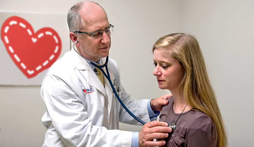 Dr. Waller examines a patient in Adult Congenital Heart Disease Clinic.