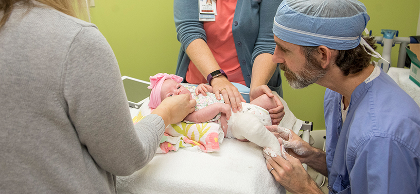 Derek Kelly, MD with Clubfoot patient at Le Bonheur Children's Hospital